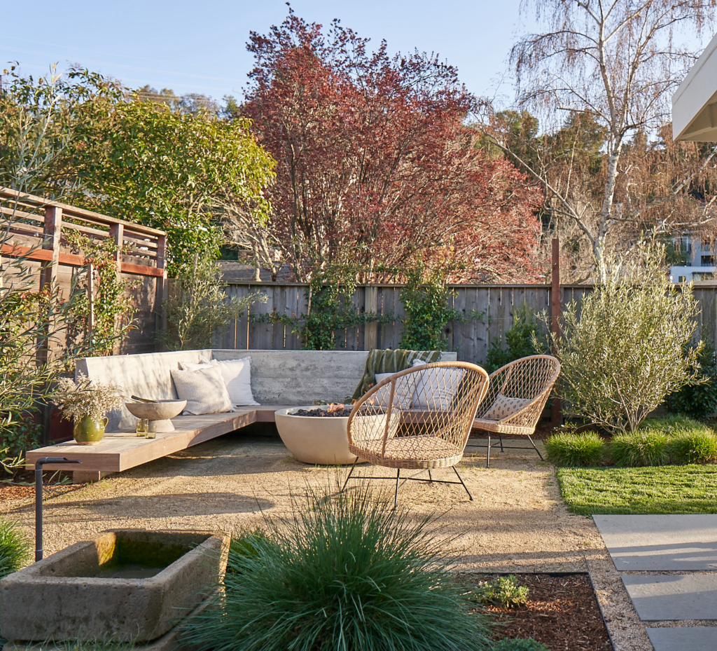 Backyard with built in seating around fire pit