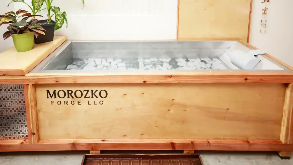 Wooden tub with metal insert and morozko logo on the side.