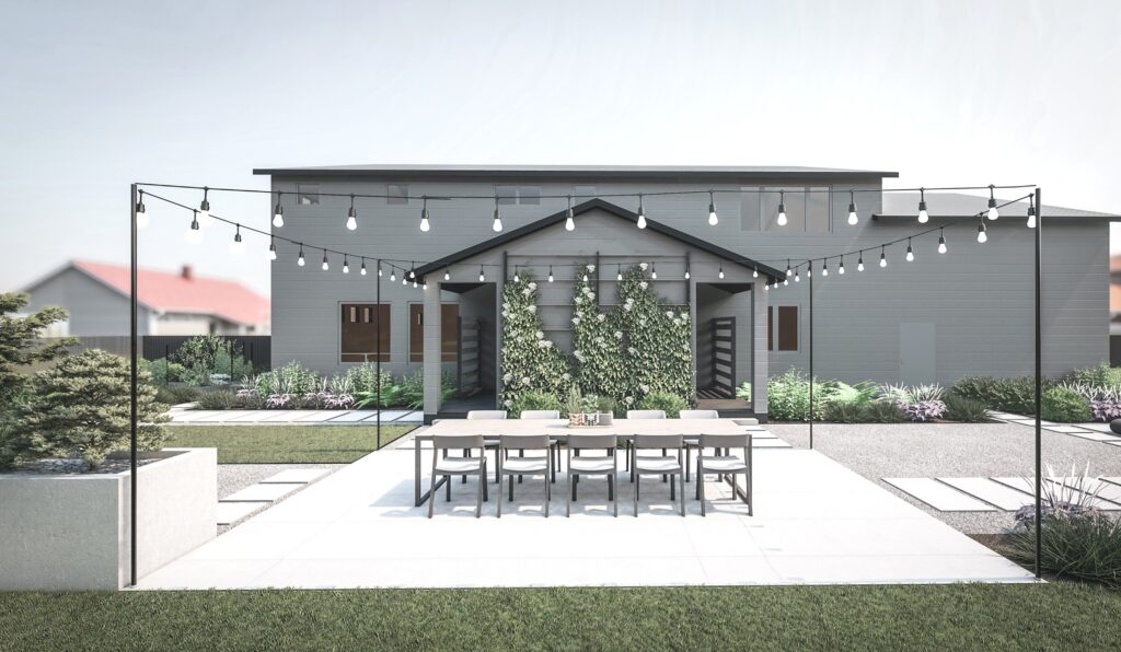 Outdoor dining area in backyard with string lights overhead