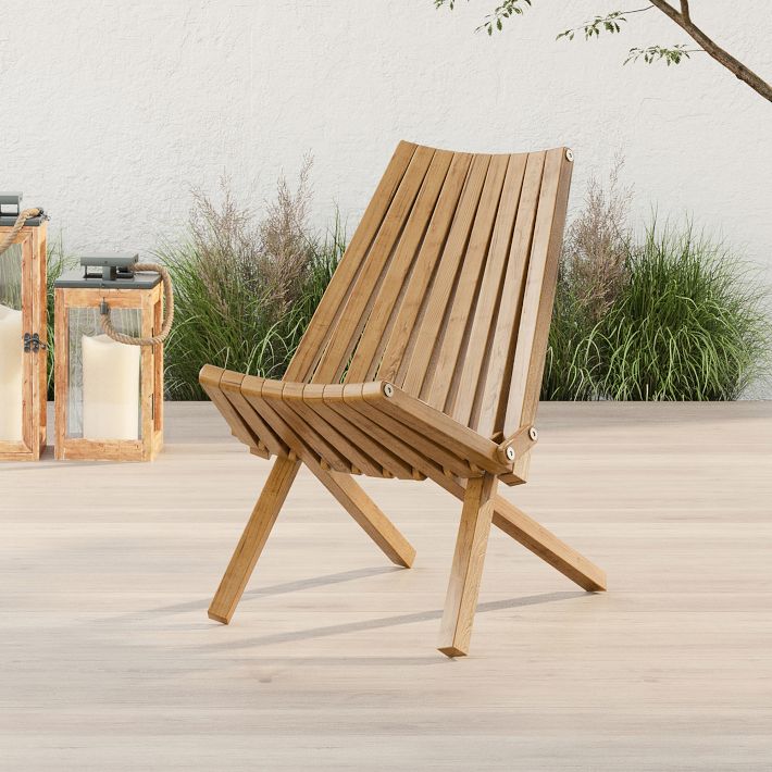 Wood slatted folding chair on deck